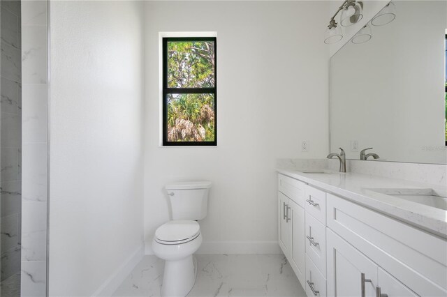 bathroom featuring vanity, toilet, and tile patterned floors