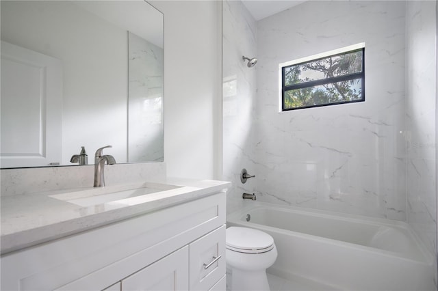 full bathroom featuring toilet, vanity, and washtub / shower combination