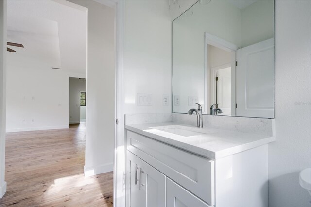 bathroom featuring vanity, ceiling fan, and hardwood / wood-style floors