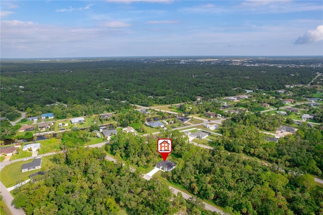 drone / aerial view featuring a view of trees