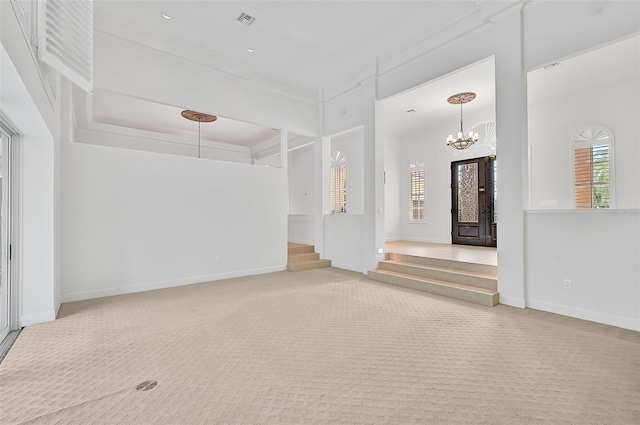 interior space with crown molding and a notable chandelier