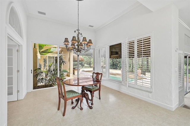 dining area featuring crown molding, light tile patterned floors, and an inviting chandelier