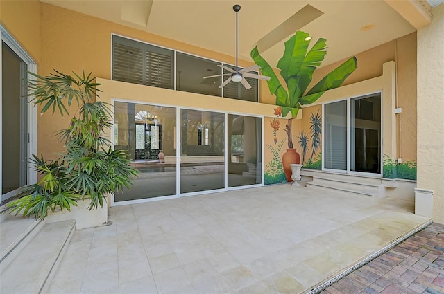 view of patio featuring ceiling fan