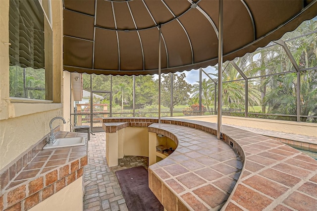 sunroom featuring sink