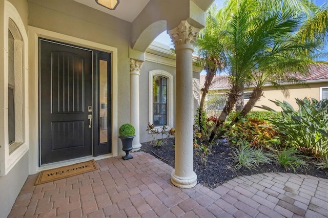 property entrance featuring stucco siding