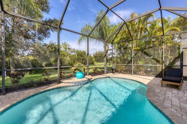 view of swimming pool with a patio and a lanai