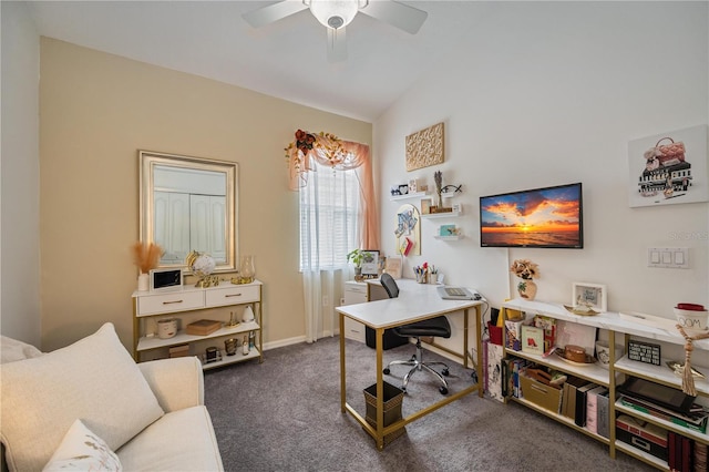 home office featuring vaulted ceiling, dark carpet, and ceiling fan