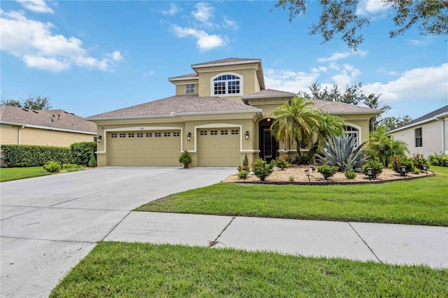 view of front facade with a front yard and a garage