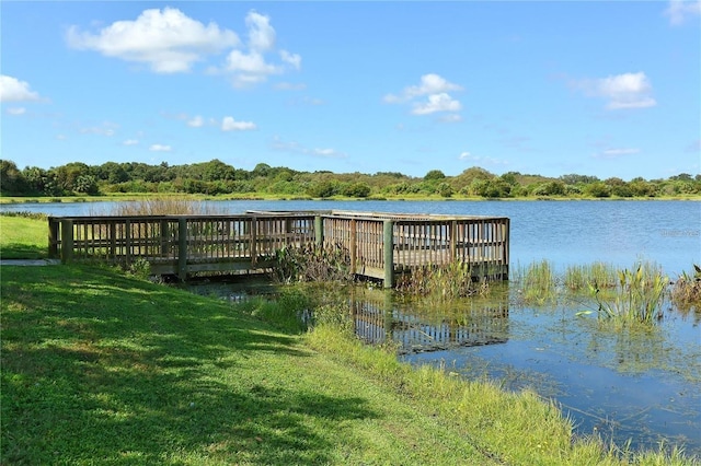 dock area featuring a water view and a yard