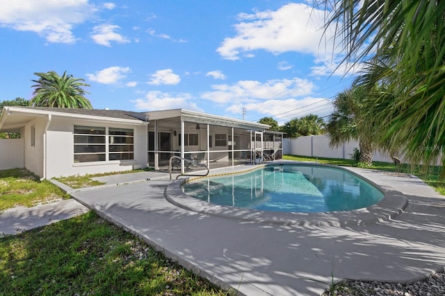 view of pool featuring a sunroom and a patio