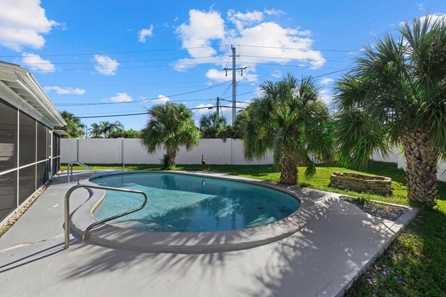 view of swimming pool with a patio