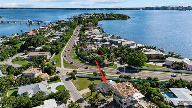 birds eye view of property featuring a water view and a residential view