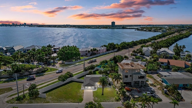 aerial view at dusk with a water view