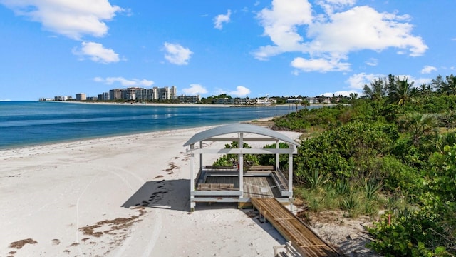 view of water feature featuring a view of the beach and a view of city