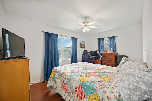 bedroom with ceiling fan and hardwood / wood-style floors