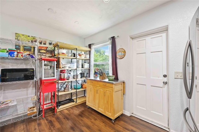 home office with dark hardwood / wood-style flooring