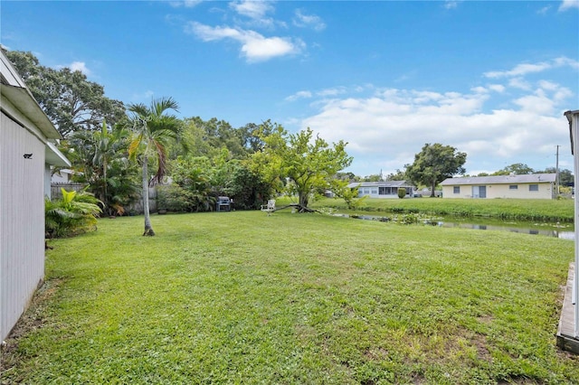 view of yard with a water view