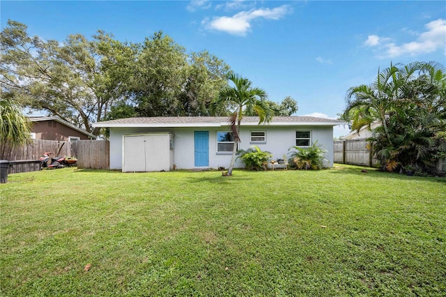 rear view of property with a lawn