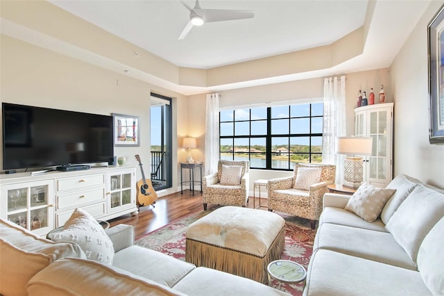 living area featuring wood finished floors and a ceiling fan