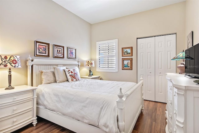 bedroom with a closet and dark wood-style flooring