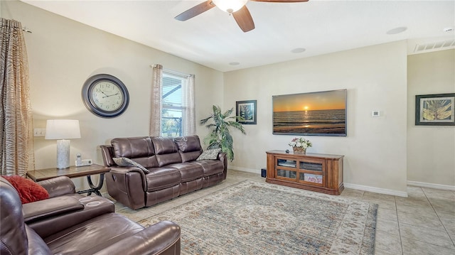 living room featuring light tile patterned flooring and ceiling fan