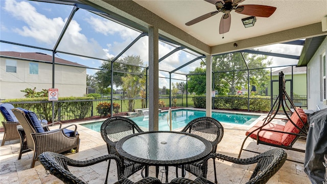 view of pool featuring a lanai, ceiling fan, and a patio area