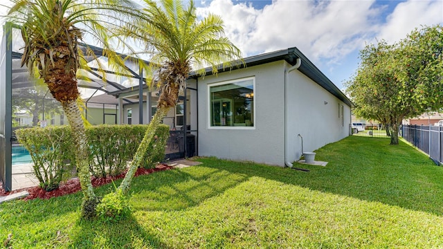 rear view of property with a yard