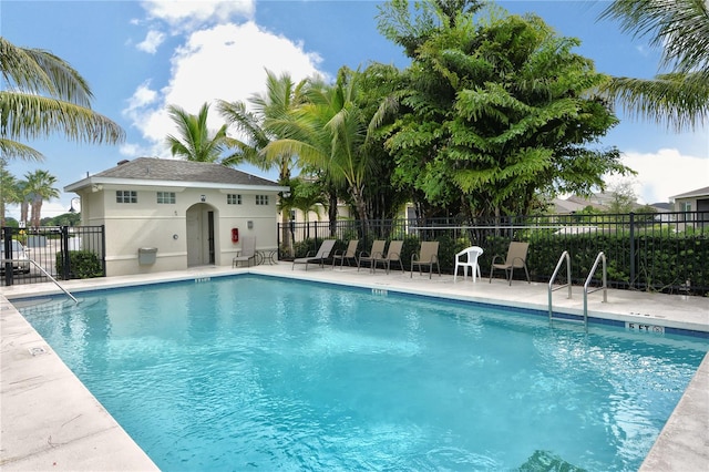 view of swimming pool with a patio area