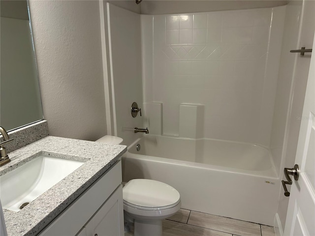 full bathroom featuring vanity, toilet, and  shower combination