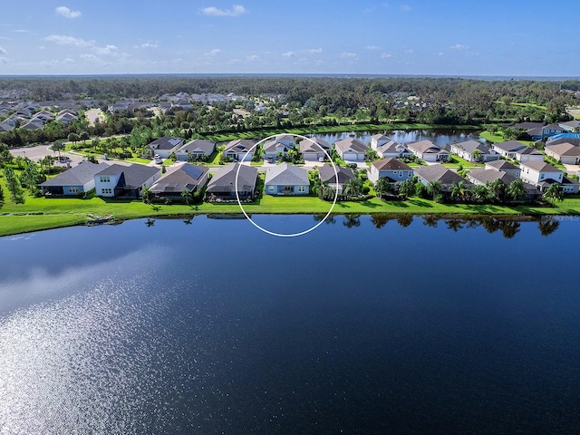 bird's eye view with a water view