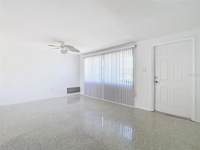 interior space with ceiling fan