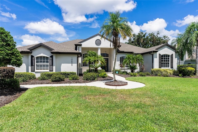 ranch-style house with a front lawn