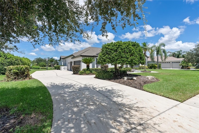 view of front of house featuring a front yard and a garage