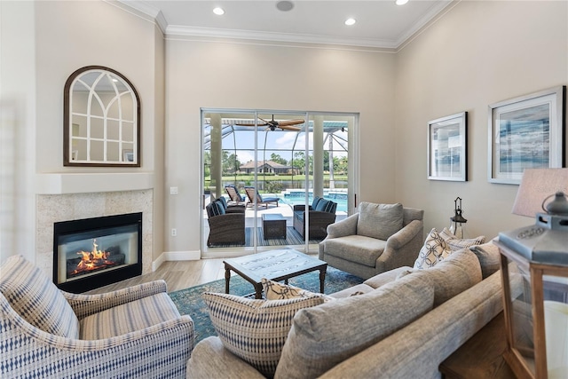 living room with hardwood / wood-style flooring and crown molding