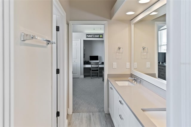 bathroom featuring vanity and hardwood / wood-style flooring