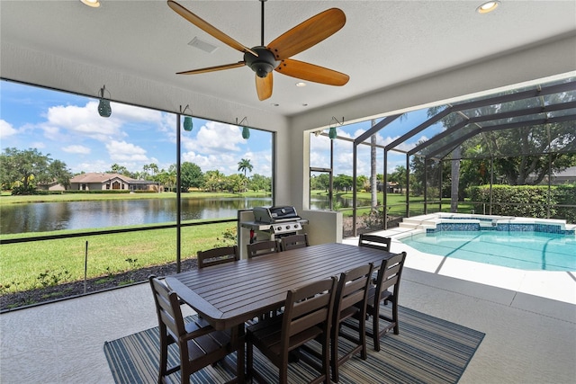 sunroom / solarium featuring ceiling fan, vaulted ceiling, a water view, and a swimming pool