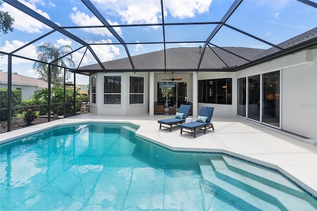 view of pool featuring a lanai, ceiling fan, and a patio