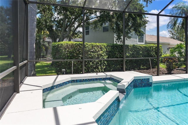 view of pool with pool water feature, a lanai, and an in ground hot tub