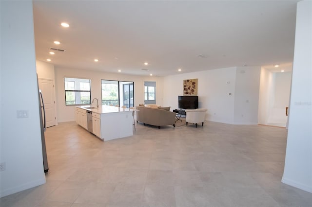 living room featuring recessed lighting and baseboards