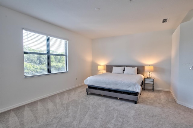 carpeted bedroom with baseboards