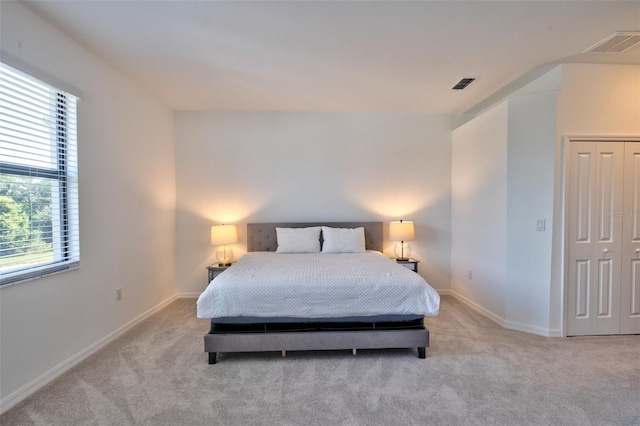 carpeted bedroom with baseboards