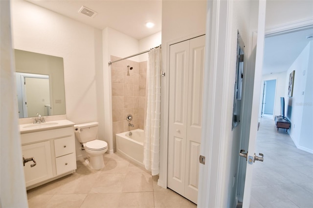 full bathroom with tile patterned floors, toilet, vanity, shower / bath combination with curtain, and baseboards