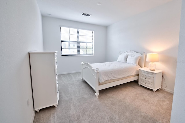 bedroom featuring light carpet