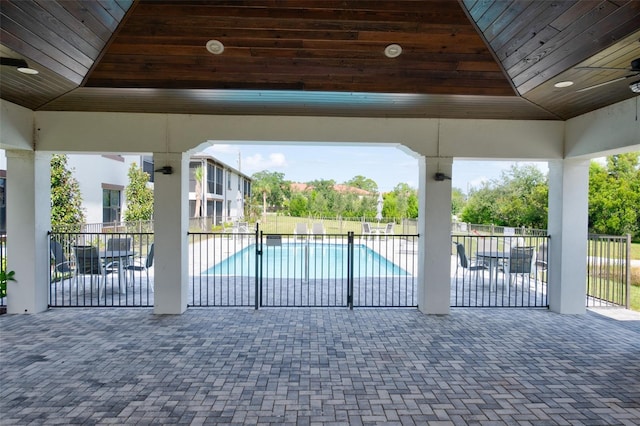 gate with a patio area and fence