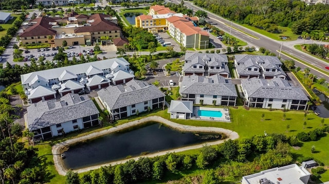 aerial view of residential area with a nearby body of water