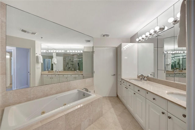 bathroom with vanity, independent shower and bath, and tile patterned flooring