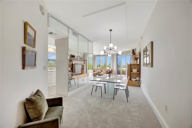 3080 Grand Bay Blvd Unit 532, Longboat Key, FL 34228 - dining area with a chandelier, light carpet, and baseboards