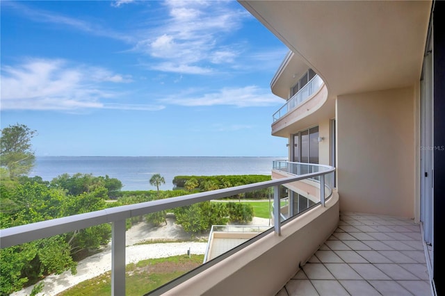 balcony featuring a water view