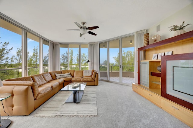 3080 Grand Bay Blvd Unit 532, Longboat Key, FL 34228 - carpeted living room featuring a wall of windows and a ceiling fan