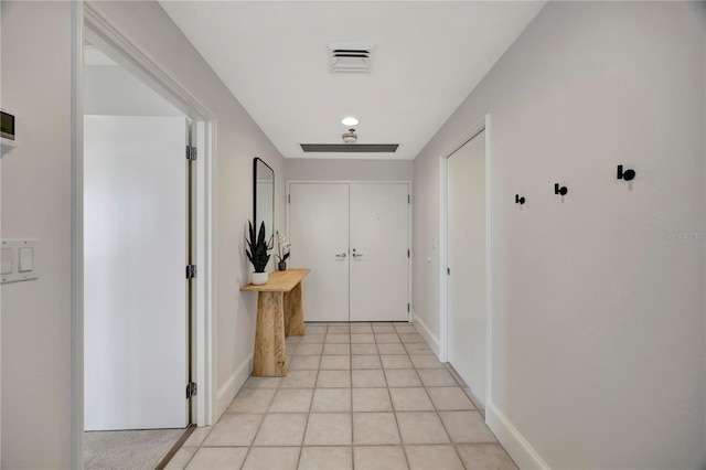 hallway featuring light tile patterned flooring